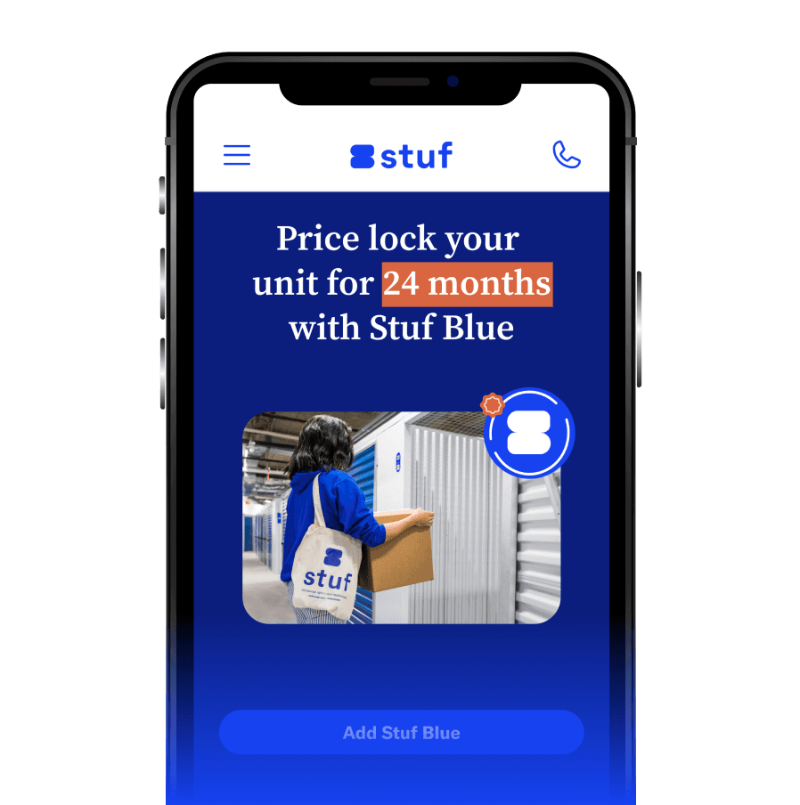 Phone screen showing the Stuf app offering a 24-month price lock with Stuf Blue, above a photo of a member carrying a box past a row of storage units