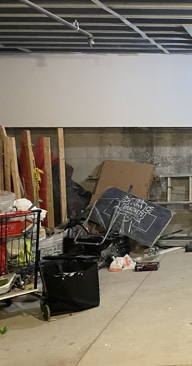 Before: 951 Madison St basement full of clutter